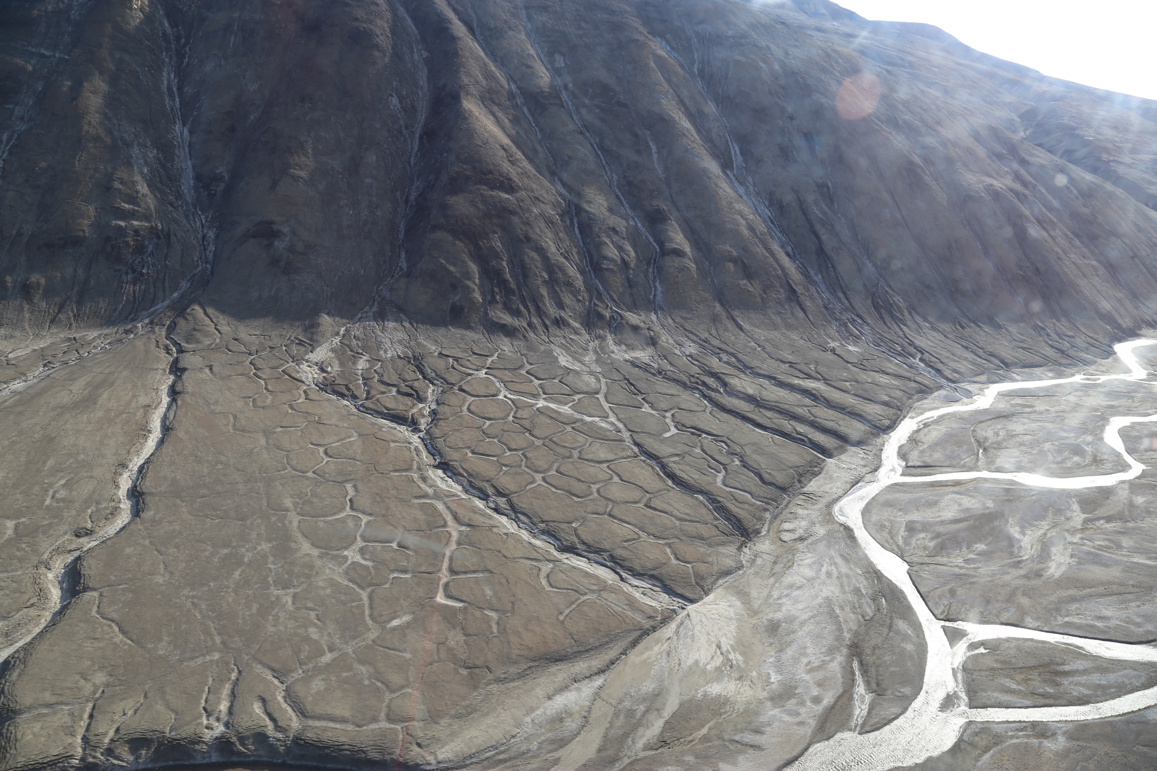 Image of regular polygons formed in the Arctic due to freeze-thaw cycles.